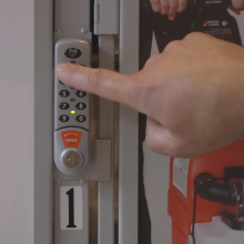 locker with hand using numbered keypad