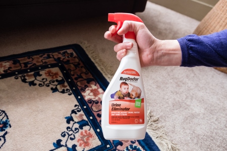 Urine Eliminator spraying on carpet