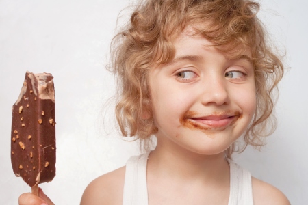 Girl eating chocolate ice cream