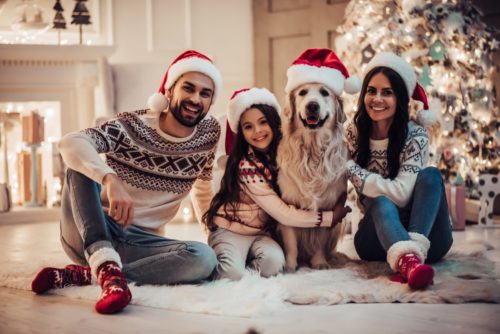 Family with dog at Christmas